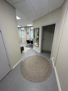 a large rug on the floor of an office hallway at Åsen Apartment, Stamsund in Stamsund