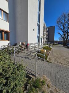a bike rack in front of a building at Family Home FeWo de lux Świnoujście in Świnoujście