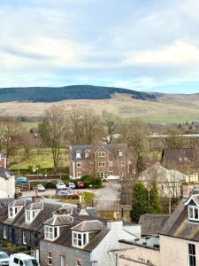 a view of a town with houses and cars at The Old Bank in Moffat