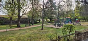 a park with a playground in a park at Las Casitas del Canal Acueducto in Segovia
