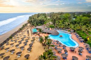 an aerial view of a resort with a pool and beach at Senegambia Beach Hotel in Kololi