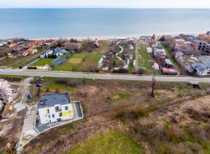 an aerial view of a town next to the ocean at Cozy apartment Vama Veche in Vama Veche