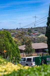 a van parked in front of a house at The Valley View Guest House in Melbourne