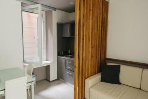 a small living room with a couch and a window at Locanda Ca Da Iride in Riomaggiore +132 photos