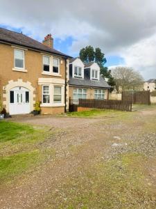 a brick house with a fence and a yard at 12A-2 Stobhill Road in Arniston