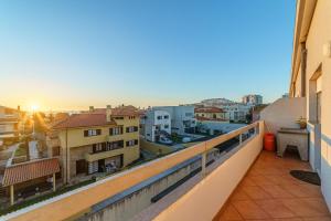 a balcony with a view of the city at Excellent location, good access to the beach in Vila do Conde