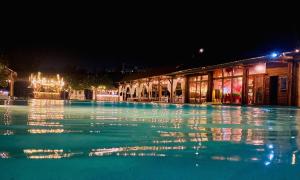 a swimming pool at night with lights on it at Ana resort Phu Yen in Liên Trì (4)