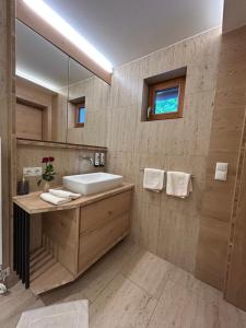 a bathroom with a sink and a mirror at Living & Relax Resorts in Sausal +45 photos