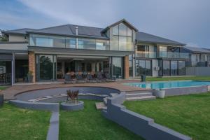 a home with a swimming pool and a house at 3066 Water Edge in Parys