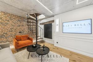 a living room with a couch and a chair at KAZA BELLA - Malakoff in Malakoff +5 photos