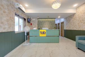 a waiting room with a job sign on the counter at FabHotel High Five - Nr Vagator Beach in Assagao +46 photos