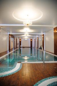 a pool in the middle of a building at Санаторій Сонячний in Verbki