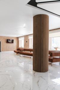 a large lobby with a large column in the middle at Санаторій Сонячний in Verbki +50 photos