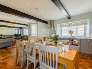 a kitchen and dining room with a table and chairs at 3 Bed in Penrith oc-89068 in Tirril