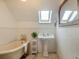 a bathroom with a bath tub and a sink at 3 Bed in Buckie oc-89824 in Buckie +20 photos
