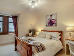 a bedroom with a large bed and a window at 3 Bed in Buckie oc-89824 in Buckie