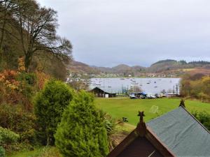 a view of a body of water with a house at 2 Bed in Lochgilphead oc-ag692 in Tayvallich +12 photos