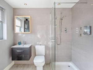 a bathroom with a shower and a toilet and a sink at 1 Bed in Crieff oc-58797 in Saint Fillans +13 photos