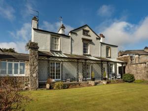 a large white house with a large yard at 2 Bed in Grange Over Sands oc-lcc01 in Grange Over Sands