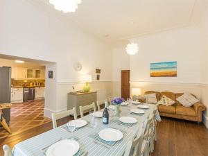 a living room with a table and a couch at 4 Bed in Eyemouth oc-ca256 in Coldingham