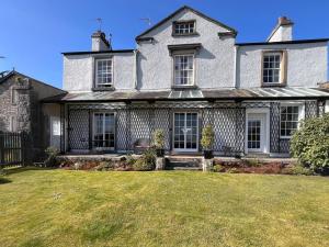a large white house with a large yard at 2 Bed in Grange Over Sands oc-lcc01 in Grange Over Sands +37 photos