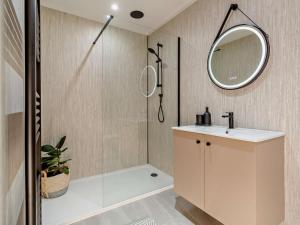 a bathroom with a shower and a sink and a mirror at 4 Bed in Wick oc-95612 in Huna +32 photos