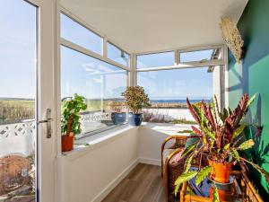 a room with a window with potted plants at 4 Bed in Wick oc-95612 in Huna