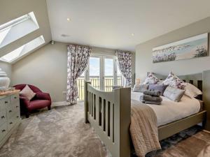 a bedroom with a large bed and a window at 2 Bed in Auchterarder oc-94546 in Auchterarder