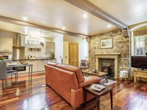 a living room with a couch and a fireplace at 1 Bed in Crieff oc-87497 in Crieff +8 photos