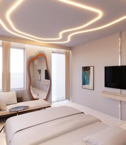 a bedroom with a large bed and a large mirror at The Corner Park Hotel in Antalya