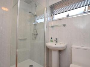 a bathroom with a shower and a sink and a toilet at 3 Bed in Galashiels oc-76698 in Galashiels +15 photos