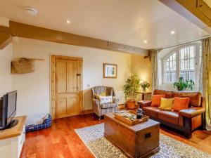 a living room with a couch and a table at 1 Bed in Crieff oc-87498 in Crieff