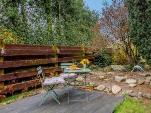 a patio with a table and two chairs in a yard at 1 Bed in Crieff oc-87498 in Crieff