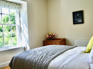 a bedroom with a bed and a window at 1 Bed in Hawick oc-88731 in Hawick