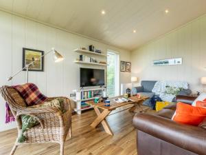 a living room with a couch and a table at 2 Bed in Wigton oc-80563 in Caldbeck