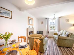 a living room with a table and chairs and a couch at 2 Bed in Berwick-upon-tweed oc-81273 in Berwick-Upon-Tweed