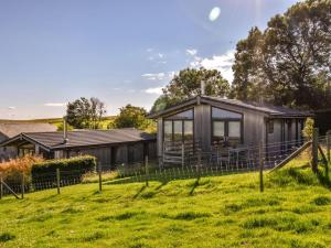 a tiny house in a field with a fence at 2 Bed in Wigton oc-80563 in Caldbeck