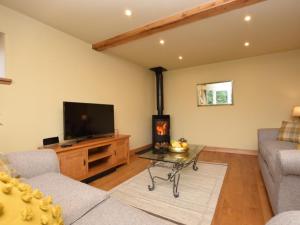 a living room with a couch and a tv at 2 Bed in West Linton oc-76383 in West Linton