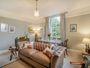 a living room with a couch and a table at 2 Bed in Ambleside oc-93287 in Near Sawrey
