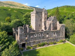 an old castle in the middle of a field at 1 Bed in Dollar oc-95872 in Powmill