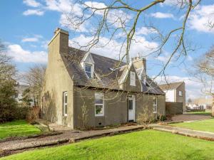 an old house in the middle of a yard at 4 Bed in Wick oc-91390 in Wick