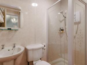a bathroom with a toilet and a sink and a shower at 5 Bed in Dunkeld oc-90844 in Birnam +29 photos