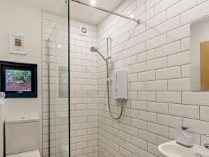 a bathroom with a shower and a sink at 3 Bed in Pitlochry oc-ca207 in Struan +19 photos