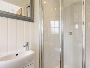 a bathroom with a sink and a shower at 1 Bed in Forfar oc-92331 in Kingsmuir