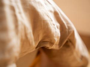 a close up of a persons wrinkled shirt at Yarn - Arlo Deluxe Suite in Ballycastle