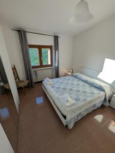 a bedroom with a bed and a window at Terrazza sul cielo in Bella