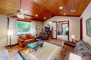 a living room filled with furniture and a wooden ceiling at Sweeping Views! Charming Home Near Dtwn Jamestown in Jamestown