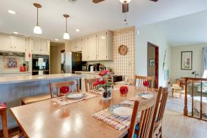 a kitchen and dining room with a table and chairs at Sweeping Views! Charming Home Near Dtwn Jamestown in Jamestown