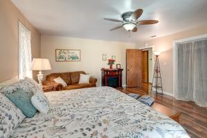 a bedroom with a bed and a ceiling fan at Sweeping Views! Charming Home Near Dtwn Jamestown in Jamestown
