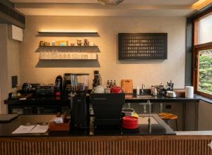 a kitchen with a counter in a restaurant at Wellesley Hotel in Pune